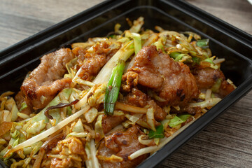 A closeup view of a container of Mushu pork.