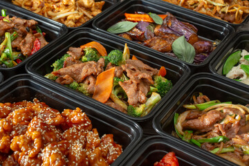 A view of several Chinese fast food entrees, as a background.