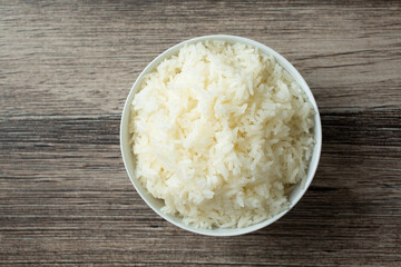 A top down view of a bowl of steamed white rice.