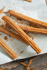 A top down view of a pile of churros.