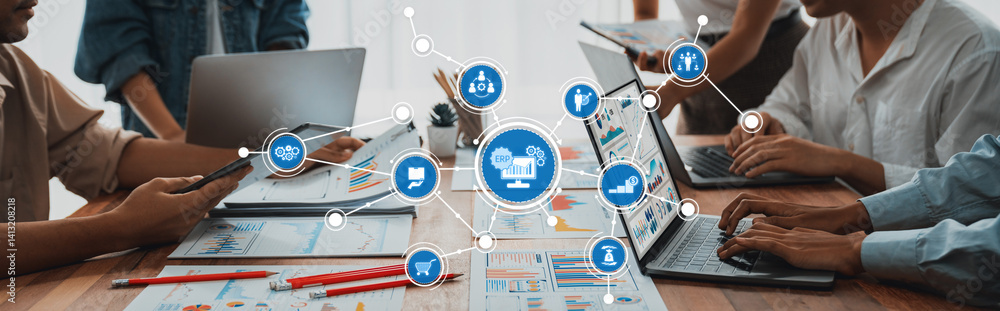 Poster A dynamic group of professionals collaborating on a project in a modern office, utilizing laptops and tablets to analyze data visualizations and innovative technology solutions. Amity
