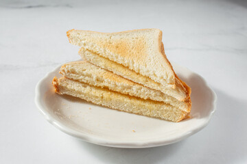 A view of a stack of white bread toast.