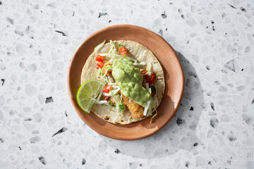 A top down view of a gluten-free, dairy-free fish taco.