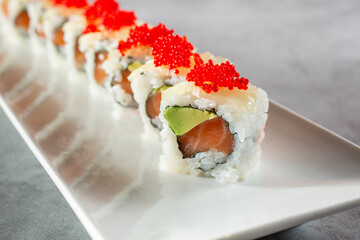 A closeup view of a salmon avocado roll.