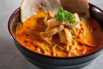 A closeup view of a bowl of spicy miso ramen.