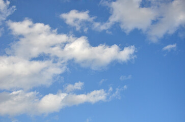 Deep blue sky and white clouds landscape in sunny day. Beautiful blue sky with white fluffy clouds background. Nature , environment ,sky background.	