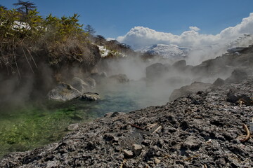 Russia. Kuril Islands. A picturesque floating thermal spring (Boiling river) near the volcano Baranovsky on the island of Iturup, whose water temperature at the source reaches 80 degrees.