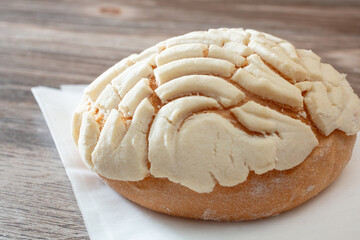 A view of a white concha pan dulce.