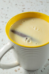 A view of a mug of atol de elote.