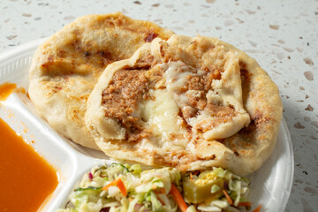 A view of a bean and cheese pupusas.