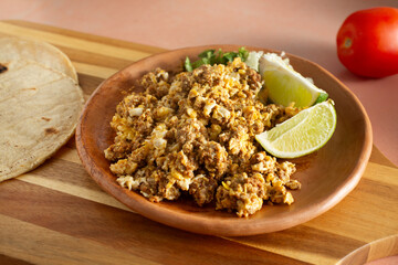A view of a plate of chorizo and eggs.