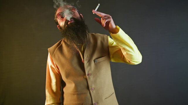 Bearded man stands puffing in bold silence