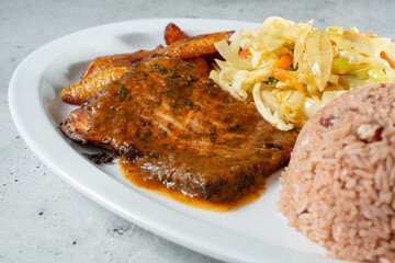 A closeup view of a plate of jerk salmon.