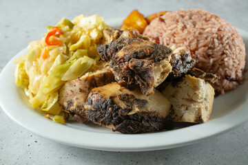 A closeup view of a plate of jerk chicken.