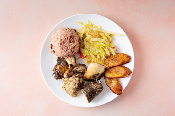A top down view of a plate of jerk chicken.