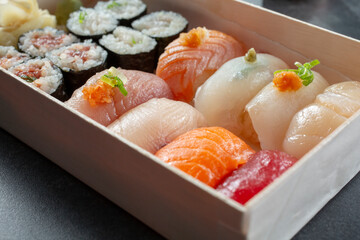 A closeup view of a platter of assorted sushi.