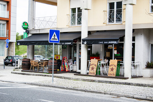 Outdoor cafe bar Jasmim with seating area in Fatima, Portugal on a sunny day