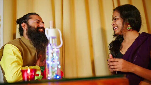 Woman kisses rose gifted by bearded dining partner