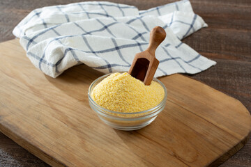 A view of a small glass bowl of cornmeal.