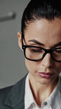 Confident Businesswoman Portrait with Glasses in Office