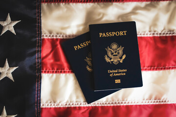 united states passports on top of an american flag abstract travel background