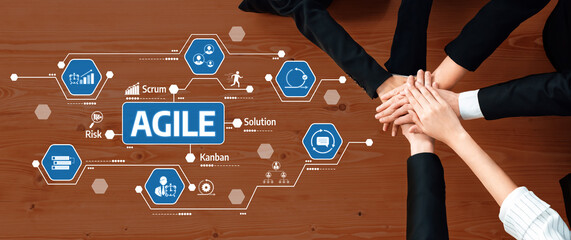 A diverse team collaborates on Agile project management, showcasing hands uniting over symbols...