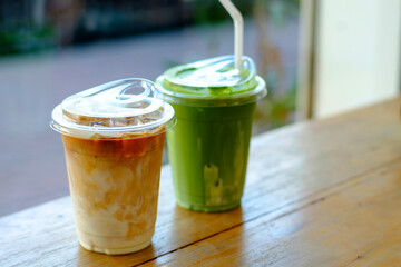 Iced matcha green tea and latte on wooden table