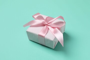 Beautiful gift box on color background