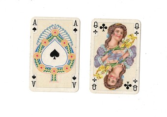 A blackjack hand of vintage playing cards isolated on a white background.