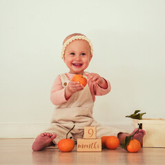 baby with pumpkin