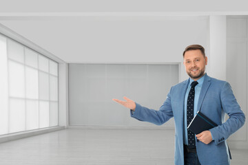 Real estate agent with notebook in room, space for text
