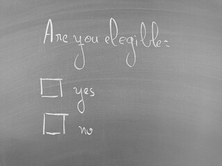 Chalkboard question: Are you eligible? Yes or No options presented.  Eligibility question on chalkboard with two checkboxes.