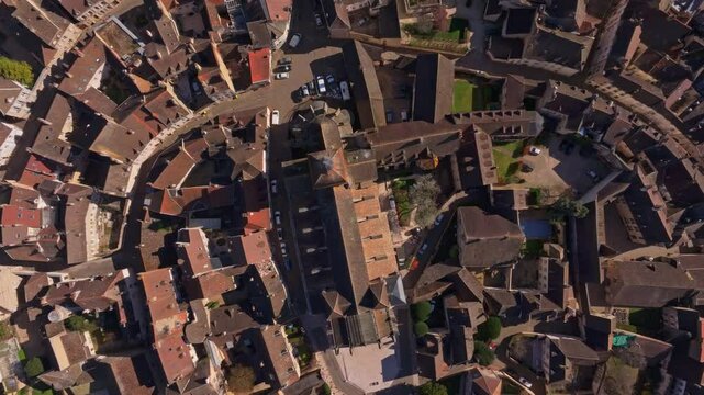 Burgundy town center with cathedral framed by old streets. Aerial drone video