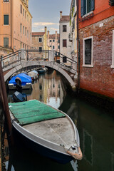 Glimpse of Rio de la Toletta, a small canal in the Dorsoduro district, with Ponte del Squero arched stone bridge, Venice, Veneto, Italy