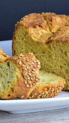 Chia seed bread, baked on a white plate.