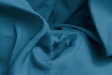 Deep teal fabric folds