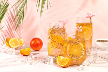 Detox diet and weight loss concept. Diet vegan cocktail with chia seeds, orange, lime, violet and ice. Summer party and healthy lifestyle advertisement. Summer banner and screen template.