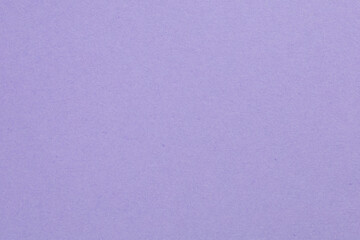 A purple background with a white object in the middle, textured origami paper backdrop