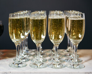 Champagne flutes filled for celebration toast.
