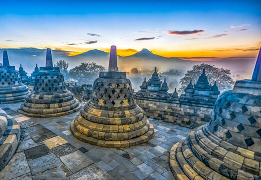 Java, Indonesia, Asia, Sunrise over Borobudur Temple, the largest Buddhist Temple in the world.