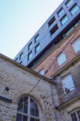 Modern architecture contrasts with historic facades in Tallinn's Rotermann, showcasing urban development in Europe in 2025