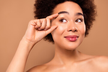 Naklejka premium Photo of tender gentle woman aesthetic cosmetology empty space promo isolated on beige color background