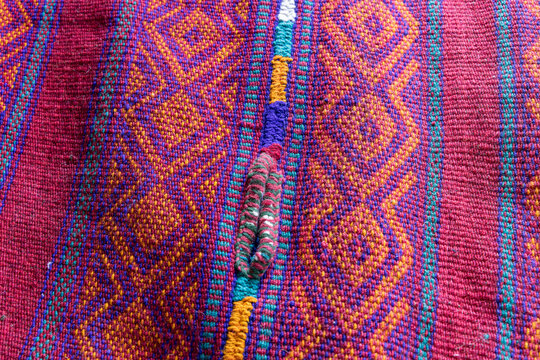 Saudi Arabia, Tabuk. Saddle blanket for sale at the market.