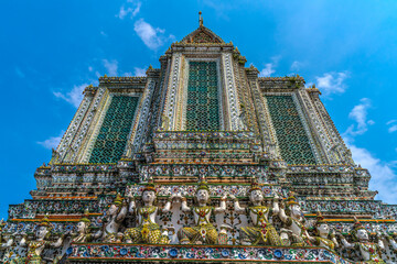 Colorful ceramic guardians, central prang, Wat Arun, Buddhist Temple of Dawn, Bangkok, Thailand.