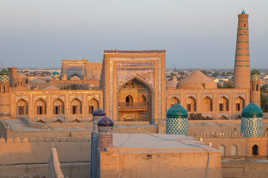 Khiva, Xorazm Region, Uzbekistan, Central Asia. Islam Khodja Madrasa and minaret.