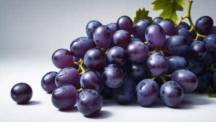 Fototapeta premium Black grapes displayed against a white backdrop
