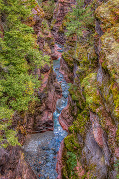 Canada, Alberta, Waterton Lakes National Park. Stream flowing through Red Rock Canyon.