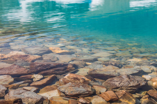 Canada, British Columbia, East Kootenay Mountains. Rocks under clear lakeshore water.