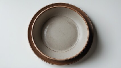 Stylish vintage brown ceramic plates with a sandy grain texture