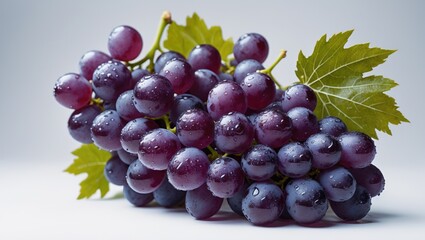 Fototapeta premium Background featuring a wet bunch of grapes with leaves isolated